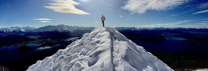 «Ӱҵ student Annika Smith standing at the summit of Roy's Pea